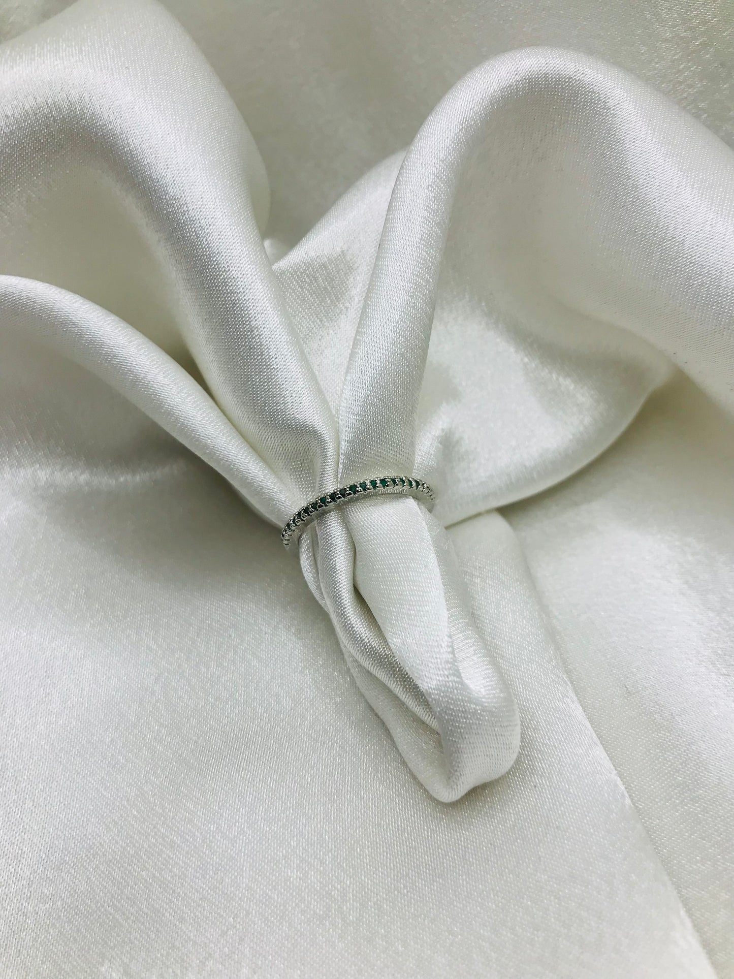 Eternity Ring with Green Gemstones